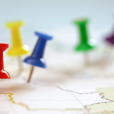 Colorful pushpins on a map representing nationwide logistics coverage