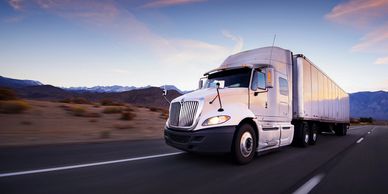 Semi-truck on a desert highway representing fast and reliable nationwide shipping