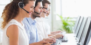 Customer service team wearing headsets providing 24/7 logistics support